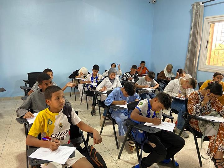 Students learning together in a classroom at Centre Michel Vieuchange.